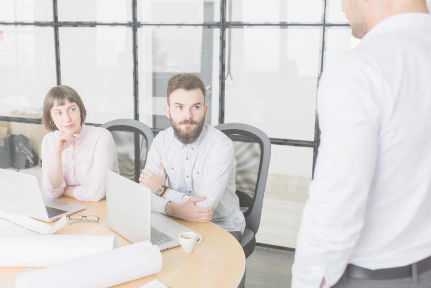 Professional meeting showing business growth charts and financial planning documents
